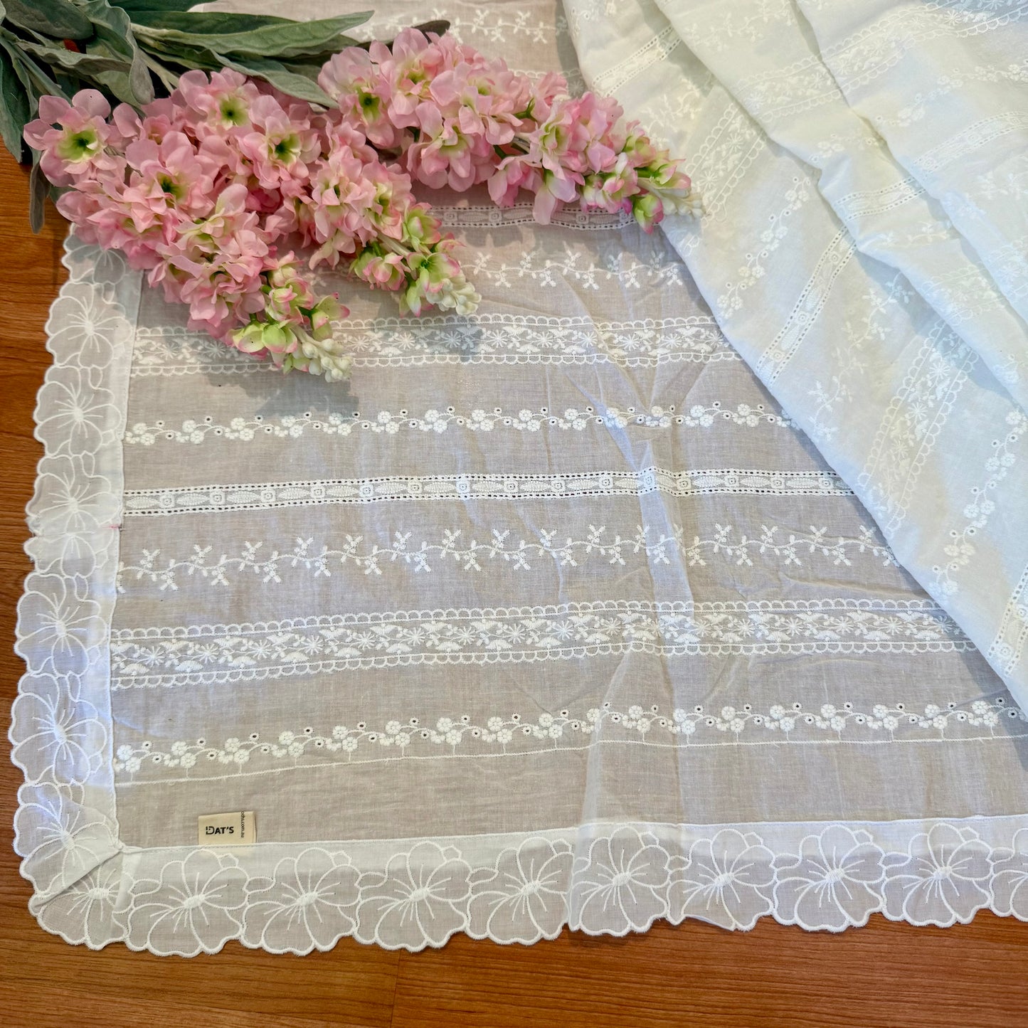 White tablecloth with embroidered flowers