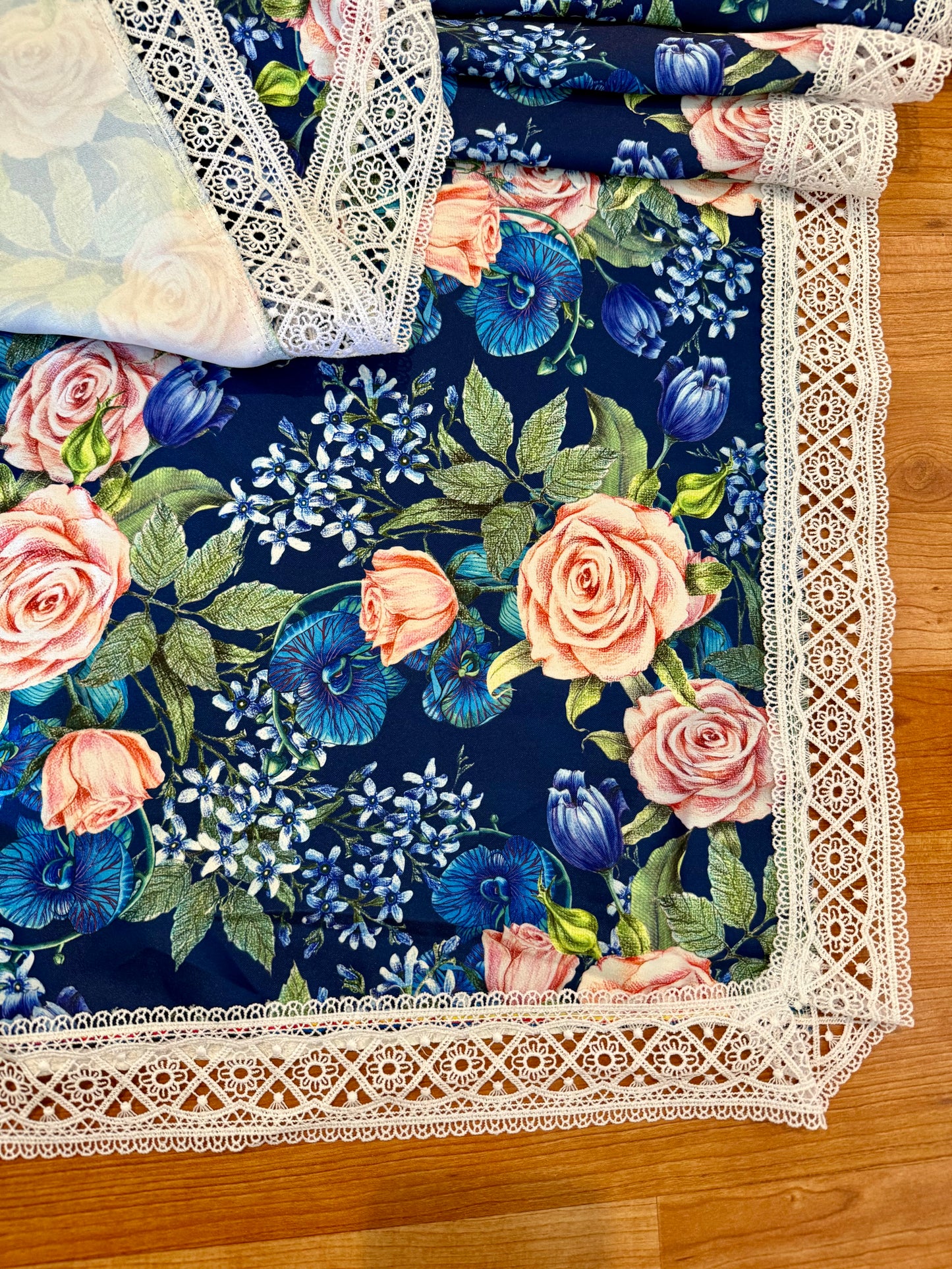 Square tablecloth with flowers on dark blue background